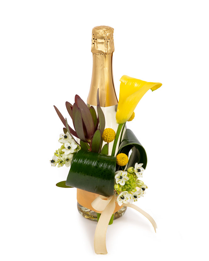 Floral Arrangement On A Champagne Bottle Magnolia Ro