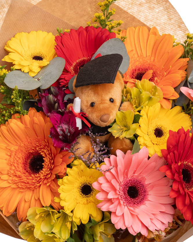 Graduation bouquet with colorful flowers and accessories