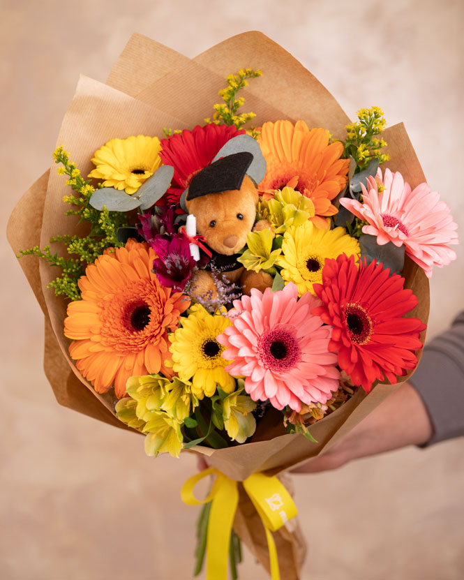 Graduation bouquet with colorful flowers and accessories