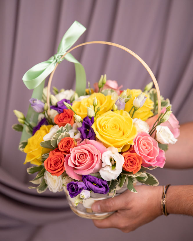 Basket with colored roses