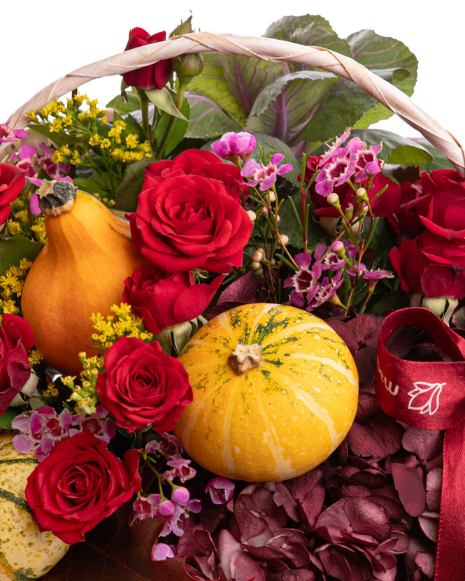 Roses, solidago and ornamental pumpkins autumn basket