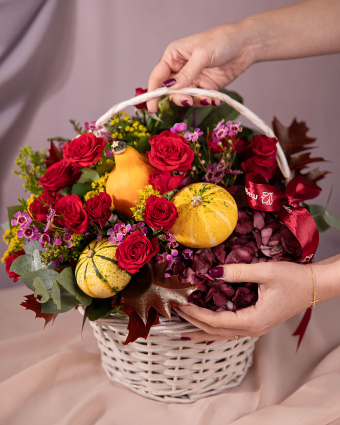 Roses, solidago and ornamental pumpkins autumn basket