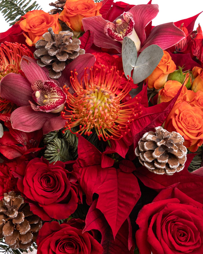 Winter bouquet with roses and pine cone